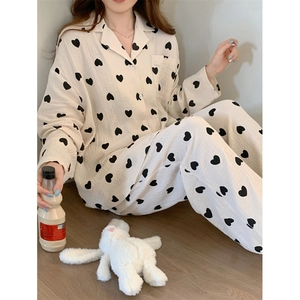 Women's cotton pajama set with black heart print featuring long sleeve button-up top and pants