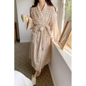 Thick warm houndstooth plush bathrobe with belt and pockets in a cozy home setting
