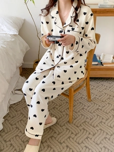 Close-up of heart print thermal pajama lapel and piping detail on soft fabric
