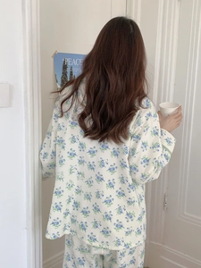 Detail of floral cotton pajamas set showing soft fabric texture and blue flower print