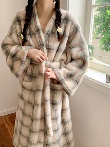 Close-up of thick plaid flannel bathrobe material and soft textured plaid pattern