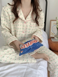 Cozy floral cotton quilted pajama set with lapel collar and buttons in a lifestyle bedroom setting