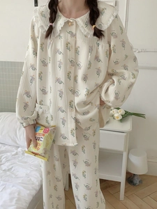 Detail shot of the lace floral trim collar on cotton pajamas with a floral pattern