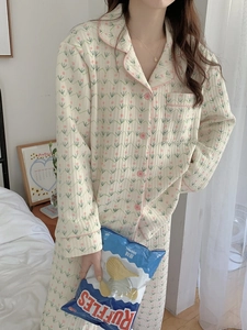 Detail of floral quilted cotton pajama set with pink tulip prints and piping detail