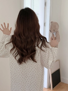 Back view of a long-sleeved cotton floral nightdress with lace collar and ruffled cuffs