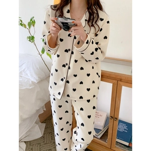 Women's cream loungewear set with black heart print and stylish ribbed texture fabric