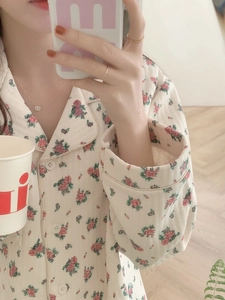 Detail of floral waffle knit pajama set with pink flowers and classic buttoned lapel