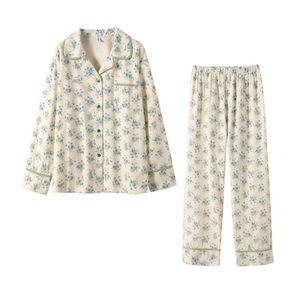 Women's cotton pajama set with floral print featuring long sleeves and green trim accents