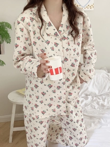 Detail of floral jacquard texture on warm long-sleeved pajamas set with buttons