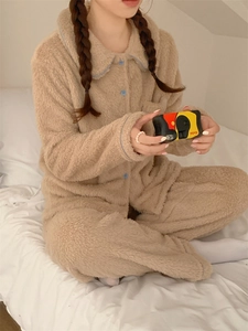 Detail of soft khaki flannel pajama set with blue piping and button-down collar