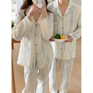 Matching couple's cotton pajamas set with striped patterns and button-down shirts