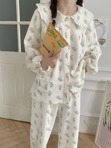 Detail of floral pajama set with white lace doll collar and waffle texture fabric