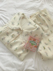Detailed view of floral quilted cotton pajama set with lace Peter Pan collar