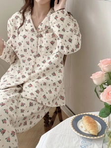 Detailed view of floral cotton pajama set with vintage patterns and front buttons