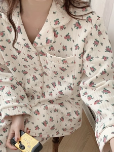 Close-up of quilted floral pajama top with notched collar and pocket details