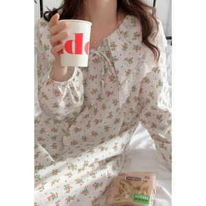 Floral cotton long sleeve nightgown with lace Peter Pan collar in cozy home setting