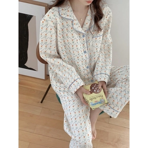 Quilted floral pajamas set in cream with long sleeves and blue piping for winter warmth