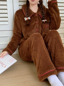 Detail of soft winter flannel pajama set with contrast pink trim and buttons