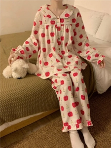 Detail of cotton pajama set with red apple prints and Peter Pan lace collar decoration