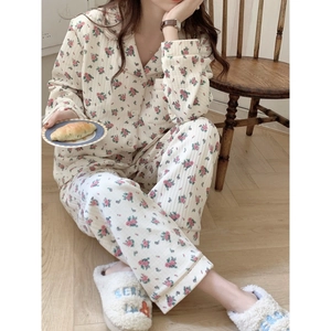 Women's floral pajama set with long sleeves and button-down top in cozy cream fabric
