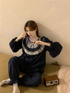 Detailed view of dark blue lace collar and bow tie on sweet princess style pajama set