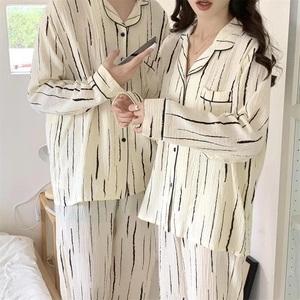 Close-up of black striped pajama set in soft cotton crepe with a minimalist design