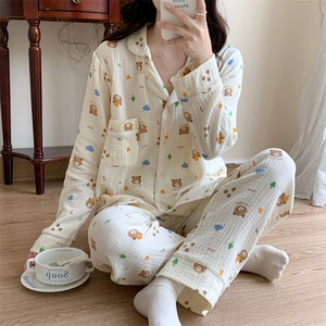 Detail of soft cotton pajama set featuring cute bear prints and a button-up collar design