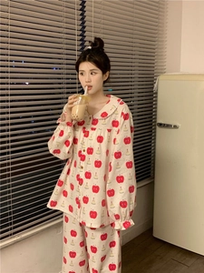 Detail of doll collar and red apple print on long sleeve cotton pajama set for women