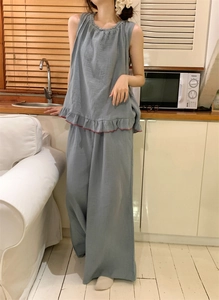 Close-up of peacock blue loungewear set featuring ruffled hem top and wide-leg pants