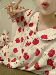 Close-up of cute apple and cake print pajama set with lace Peter Pan collar