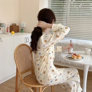 Cozy long-sleeve women pajamas with bear print in a stylish home setting