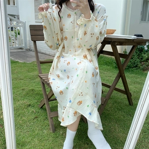 Detail of cute bear pattern and lace collar on cream long-sleeved gauze nightdress