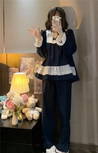 Detail of vintage navy blue pajama set with lace embroidery and square collar