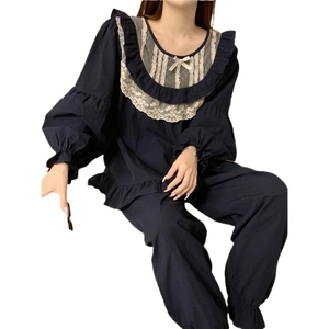 Navy blue lace pajama set with long sleeves, ruffle cuffs and elegant bow details