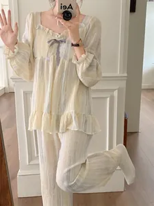 Detail view of marble pattern loungewear set featuring square neck and ribbon bow