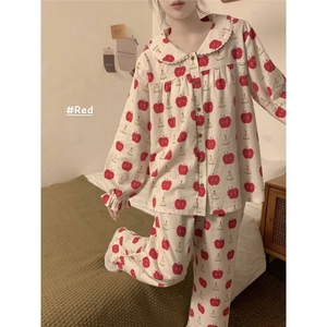 Cozy cream pajama set with red apple prints featuring a Peter Pan collar and soft fabric
