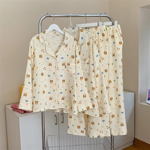 Detail of soft cotton gauze pajama set with cute cartoon bear prints and lapel collar