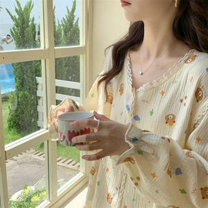 Close-up of bear and star pattern on breathable cotton pajama set with lace trim