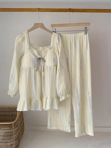 Detail of square-neck loungewear set with ruffle trim and grey brush stroke patterns