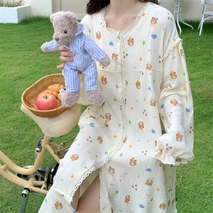 Detail of bear print loungewear with lace collar and elastic ruffles in nature setting