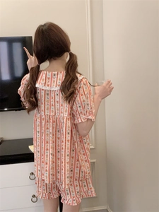 Rear view of striped short-sleeve pajama set featuring cute bear prints and ruffled hems