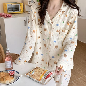 Women's cream long-sleeve pajama set with cute brown cartoon bear and tree prints