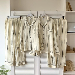 Detail of striped long-sleeve pajama set featuring seersucker texture and button-up front