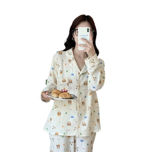 Women's cream long sleeve pajama set with cute cartoon bear prints and lapel collar