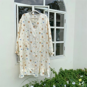 Close-up of bear print sleepwear with delicate lace trim and ruffled sleeve detail