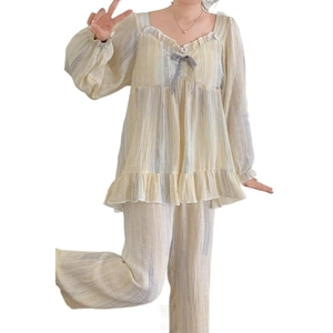 Women pajama set with ruffle square neck and striped pants featuring padded chest support