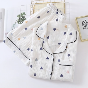 Close-up of heart print pajama set with soft cotton fabric and contrast piping detail