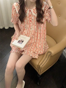 Detail of cartoon bear heart print loungewear set with lace collar and striped pattern