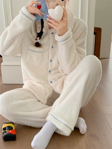 Detail of soft fleece thermal pajama set with blue buttons and cozy plush texture