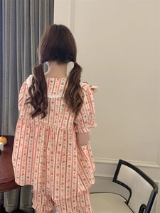 Rear view of striped loungewear set for women featuring cartoon bear patterns and lace trim